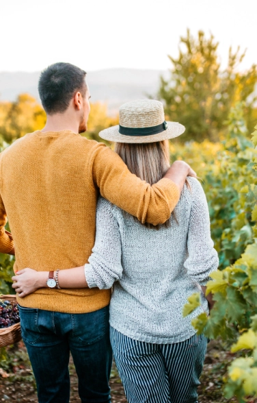 Couple Strolling Through Vineyards