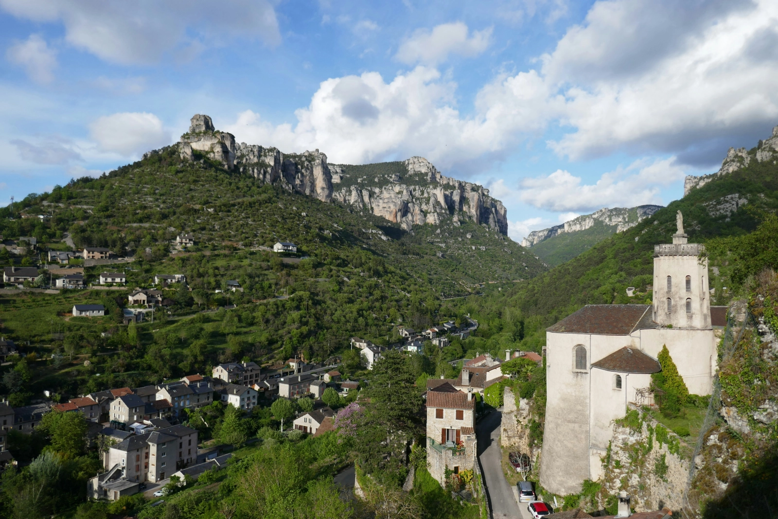 Dramatic limestone cliffs and stone village in the Cévennes region of southern France – ideal for off-the-beaten-path hikes, slow food, and heritage discovery.